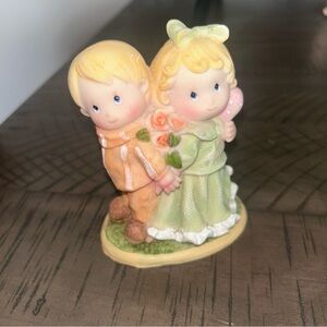 Charming Figurine with Green and Orange Accents